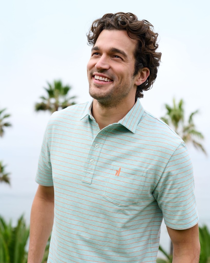 Man in a mint striped polo, casual coastal wear